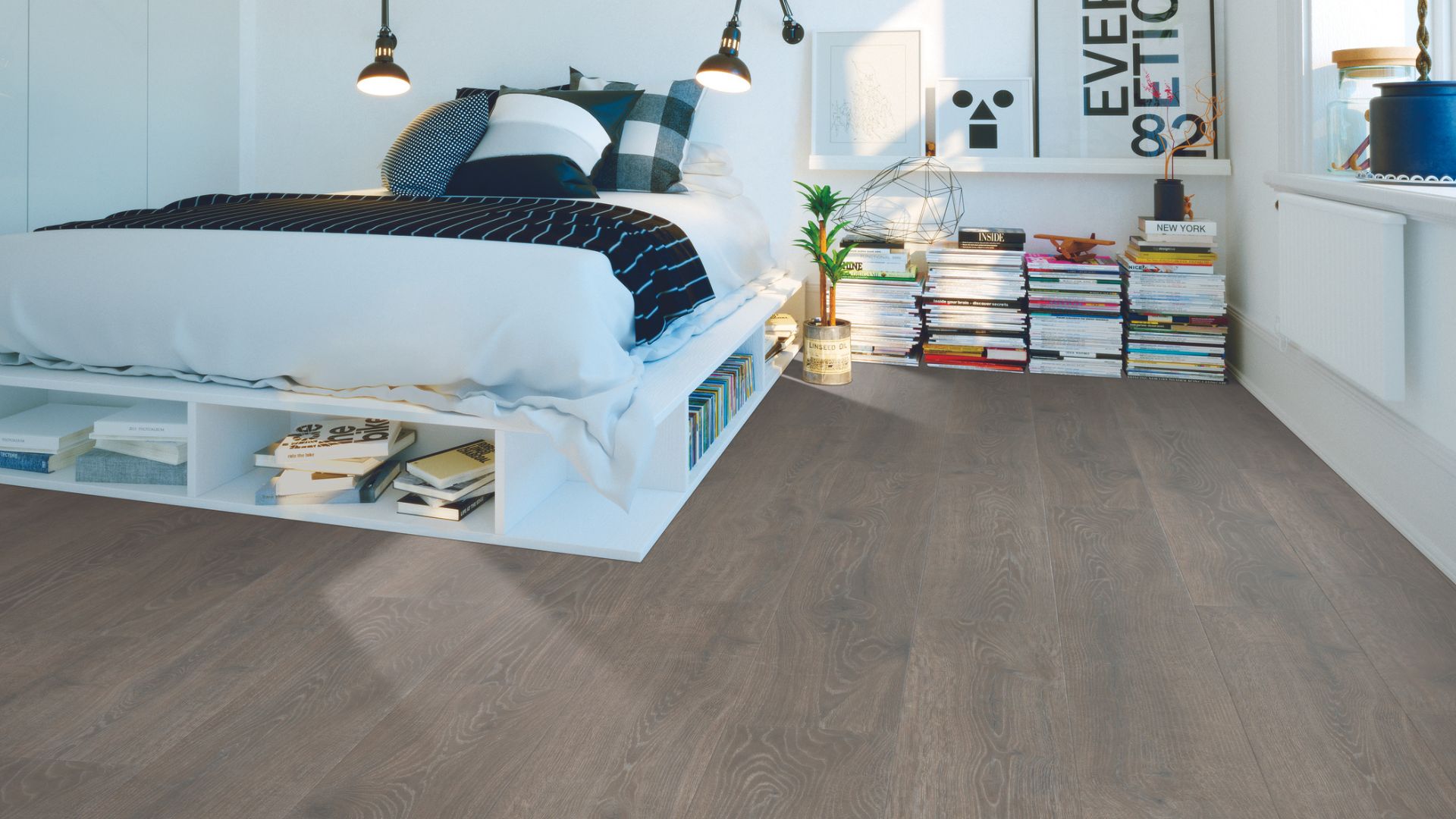Grey laminate wood flooring in a bedroom.